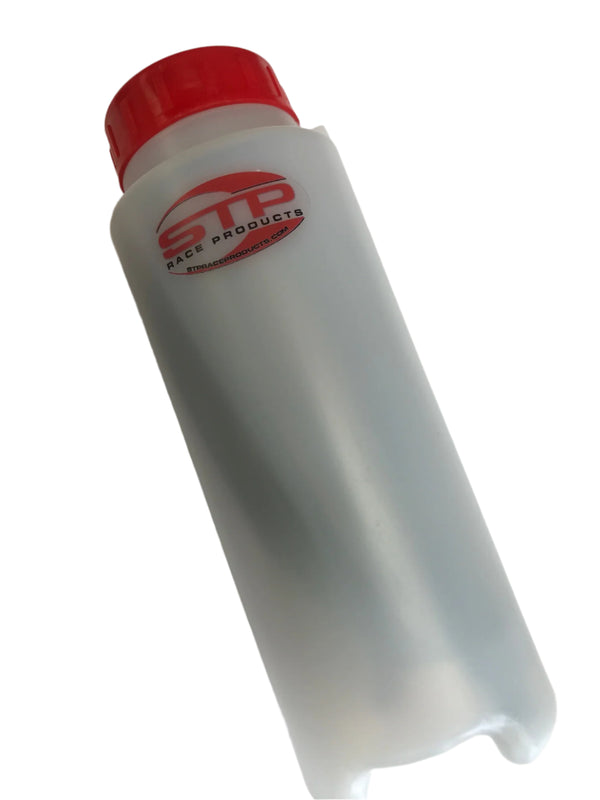 White bottle with red cap on a white background